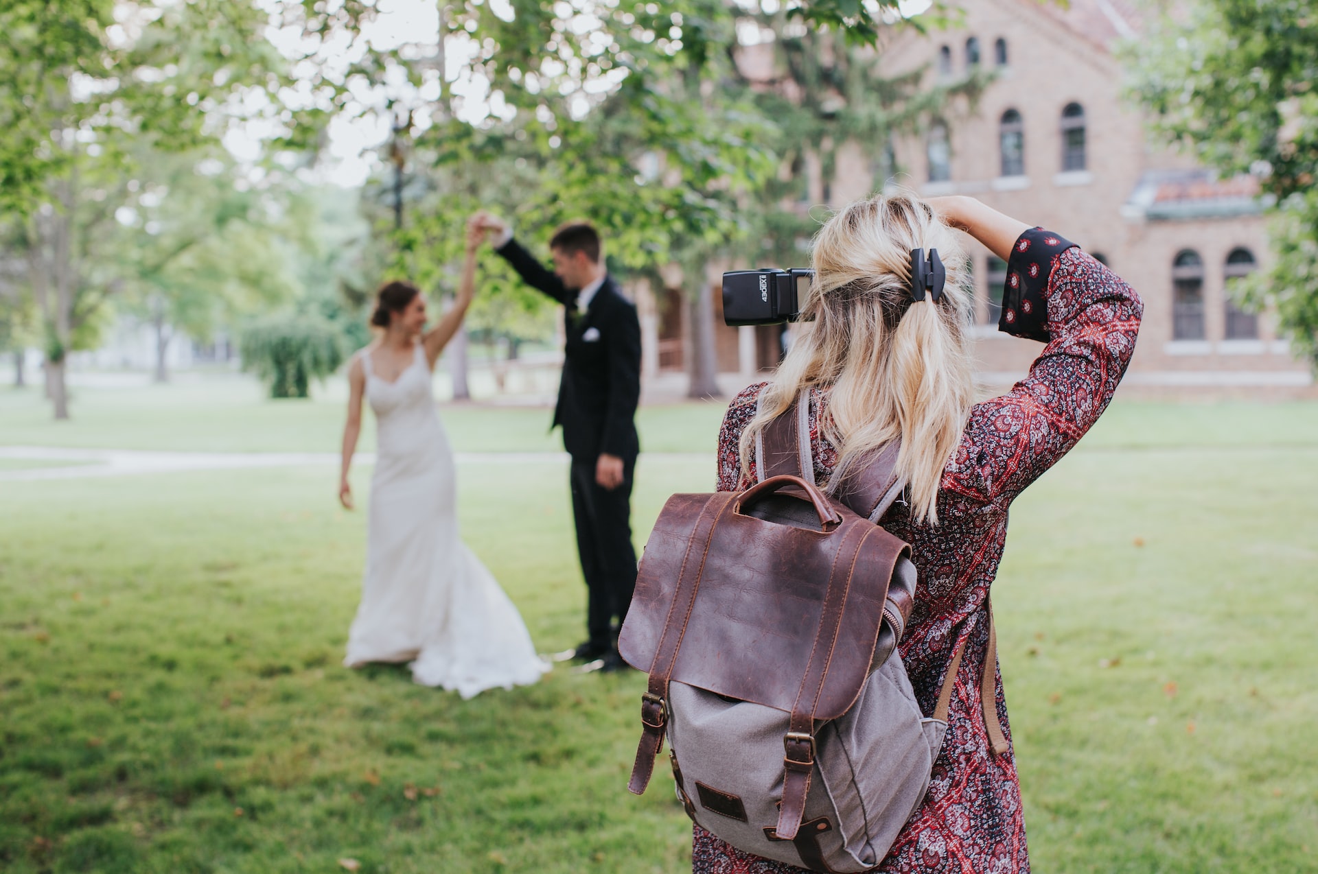 photographer capturing bride and groom